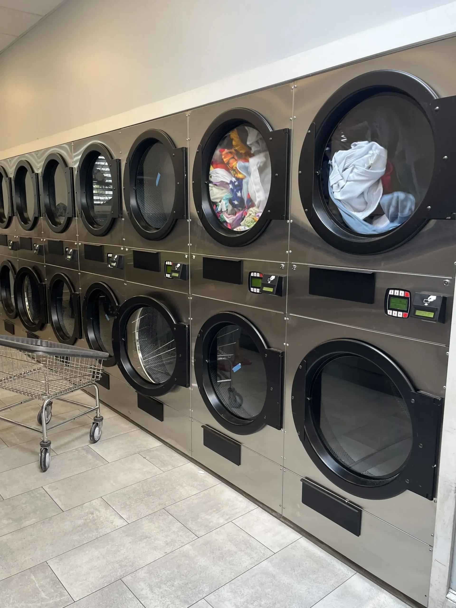 A row of dryers at Aqua Laundry